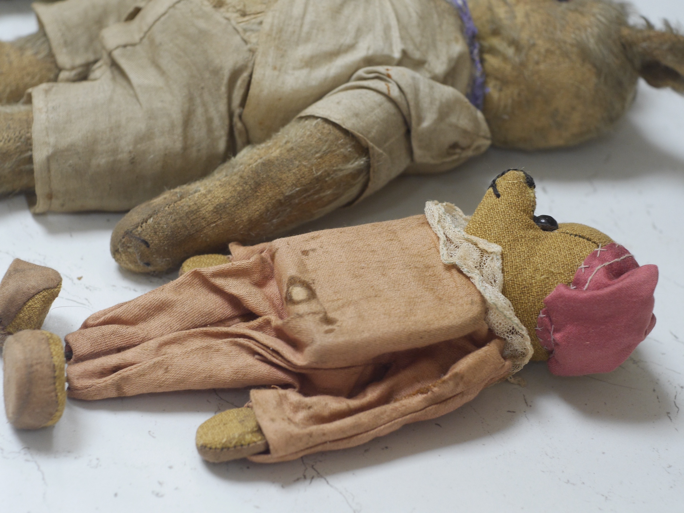 An early 20th century German hump backed plush teddy bear and three others, German teddy 30cm high. Condition - the German teddy has a short split on the back seam and glue on the front leg that needs removing and plush